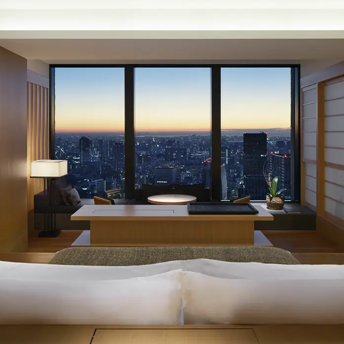 Private suite over a city skyline